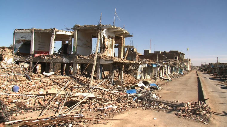 Bombed-out houses, buildings pocked with bullet holes and mortar craters line the streets of Mir Ali, Pakistan.