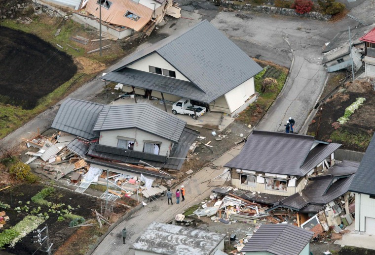 Image: An aerial view shows collapsed houses after an earthquake in Hakuba town, Nagano prefecture