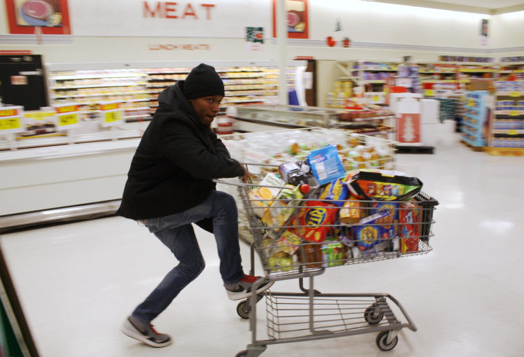 Image: Ferguson resident D. Hampton, a pseudonym, goes shopping at a local grocery store