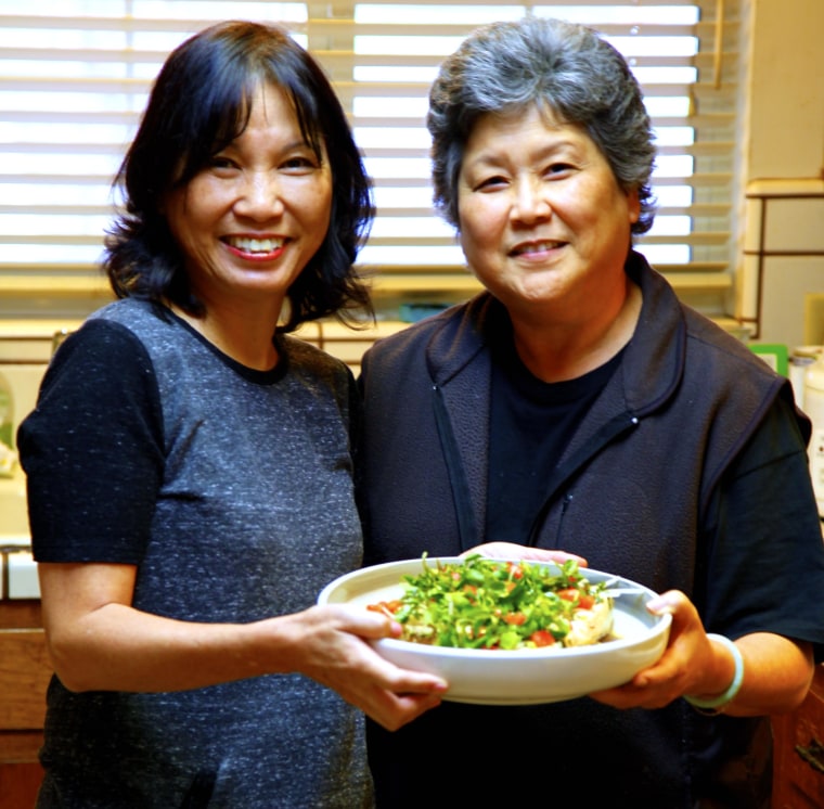 Priscilla Ouchida (left) and Joanne Morita (right) prepare Grandma Bette's Watercress Tofu Salad.