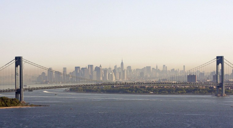 Image: A layer of smog can be seen above Manhattan through the Verrazano-Narrows Bridge in New York