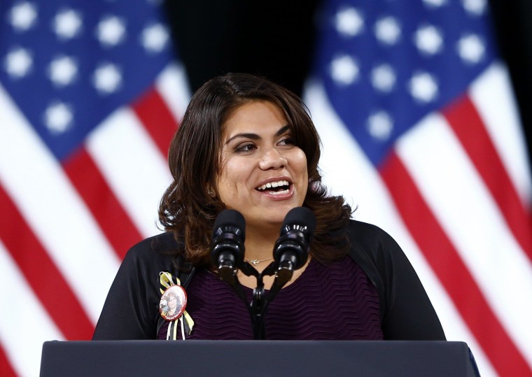 Image: Undocumented DREAMer Silva introduces U.S. President Obama before the president's remarks on his use of executive authority to relax U.S. immigration policy during a speech at Del Sol High School in Las Vegas, Nevada