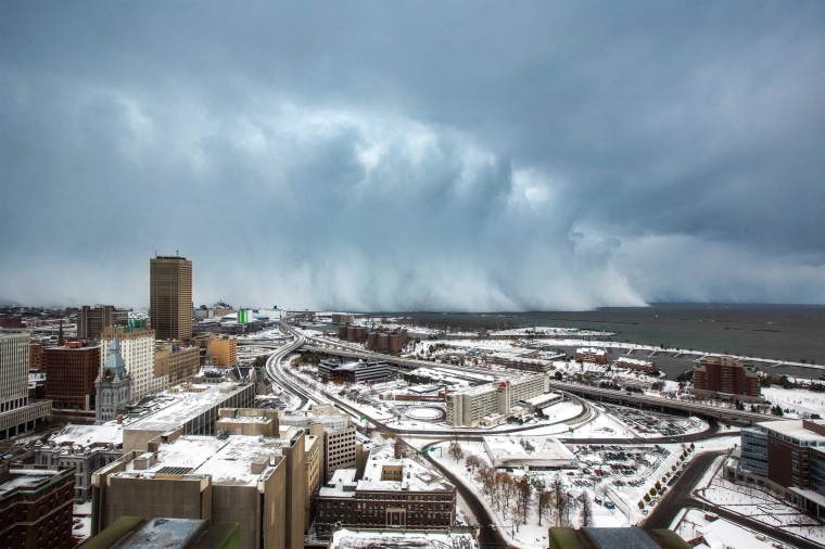 Image: Storm clouds and snow blows off Lake Erie in Buffalo, New York