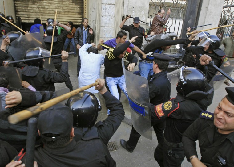 Image: Riot police clash with protesters in Cairo
