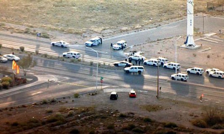 Image: Police vehicles gather near Kirtland Air Force Base in Albuquerque, N.M., on Monday, Dec. 1.