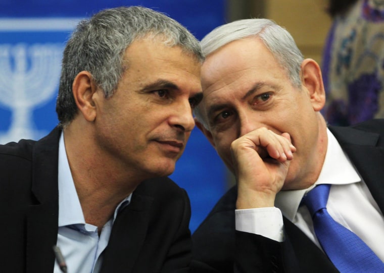 Kahlon, Israel's Communications and Social Welfare Minister speaks with Prime Minister Netanyahu during a Likud party meeting in Jerusalem