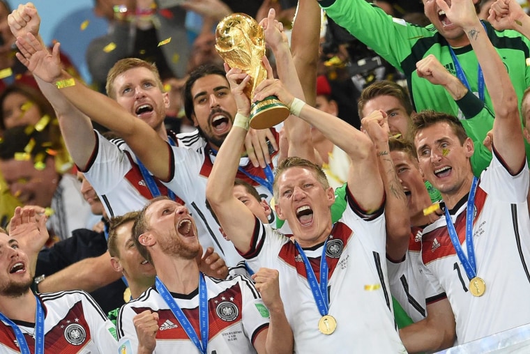 Bastian Schweinsteiger of Germany lifts the World Cup trophy with