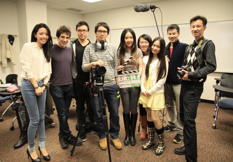 Director Yung-Jen Yang (fourth from left) and Producer Cathy Jiang (fifth from left) wrapping up the first day of shooting "Study Abroad." 