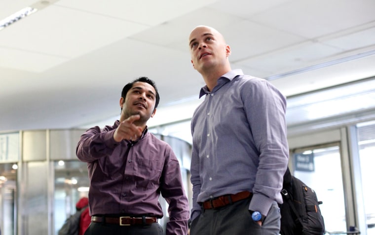  Mohammad Usafi, 25, waited anxiously outside airport security doors at SFO with his one-time employer, Marine Capt. Adrian Kinsella, an Afghanistan veteran.