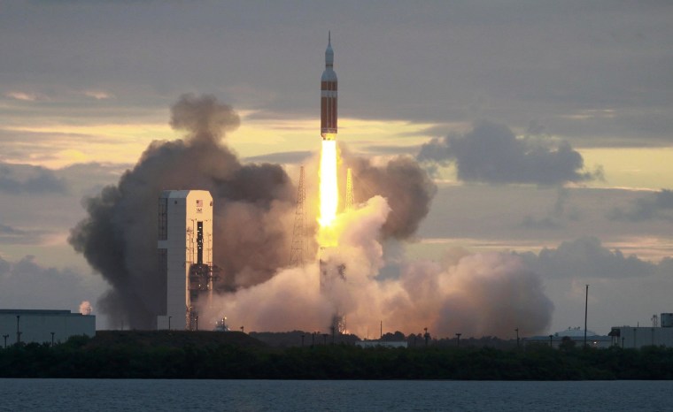 Image: The Delta IV Heavy rocket with the Orion spacecraft lifts off from the Cape Canaveral Air Force Station in Cape Canaveral