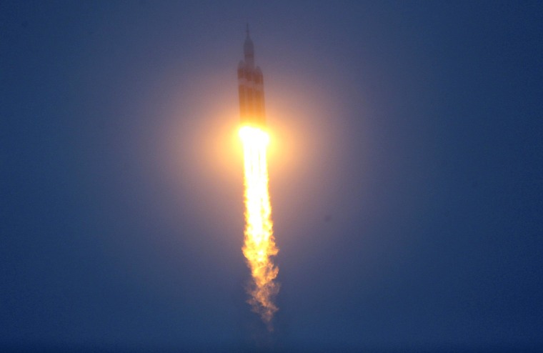 Image: The Delta IV Heavy rocket with the Orion spacecraft lifts off from the Cape Canaveral Air Force Station in Cape Canaveral