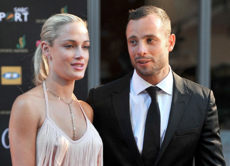 Image: South Africa's Olympic sprint star Oscar Pistorius and his model girlfriend Reeva Steenkamp