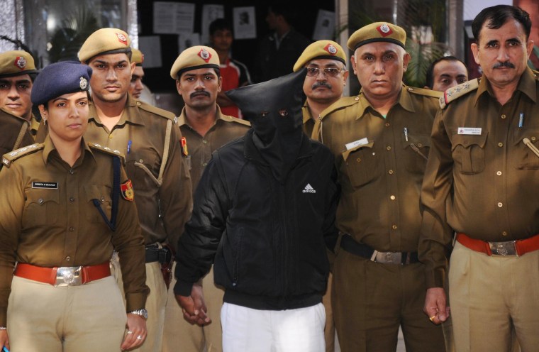 Image: Uber taxi driver accused of raping is taken to a court in New Delhi.