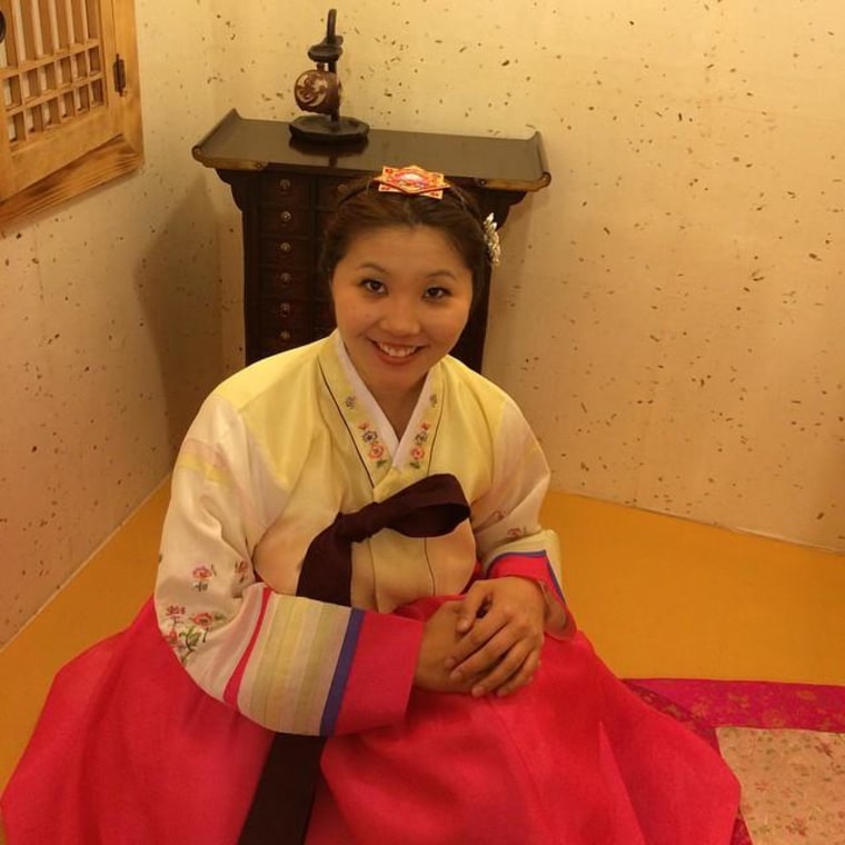 Sporting a traditional Korean dress (hanbok) at Hanbok Cafe in Seoul, South Korea.