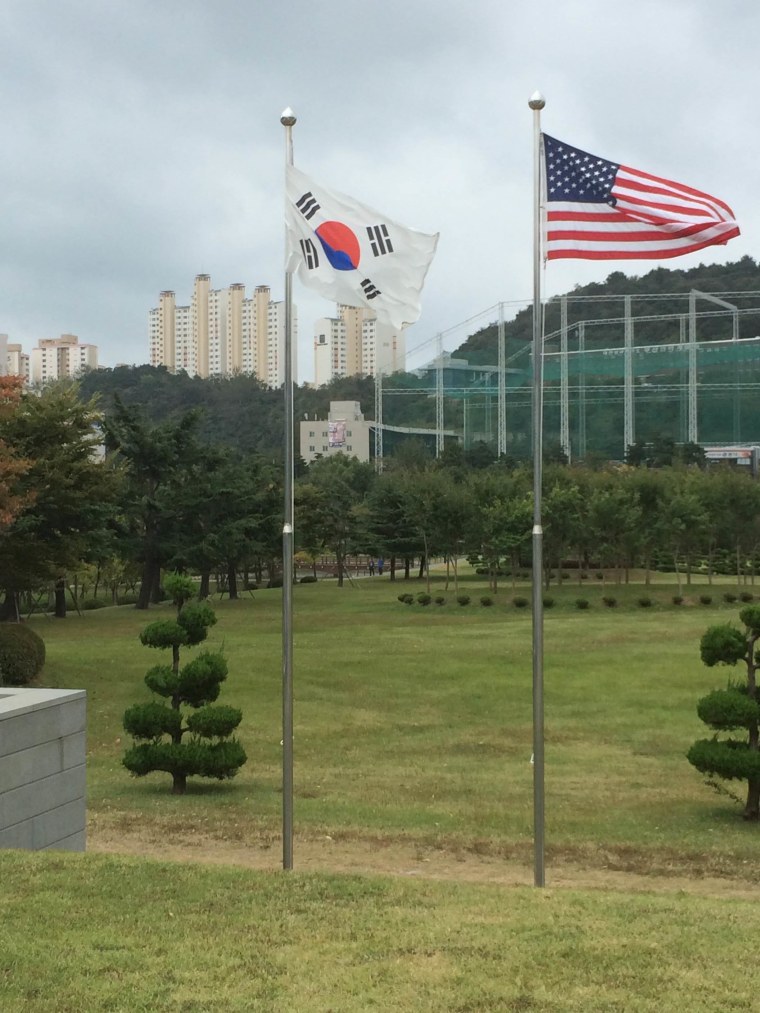 The Korean and American flags at the UN Cemetery in Busan, South Korea
