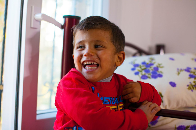 Murad, 2,  reacts after being shown his bedroom at the Beyti orphanage in Reyhanli, southern Turkey.