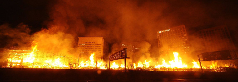 Image: Flames spread from a massive fire at the site of a seven-storey downtown apartment complex under construction in Los Angeles