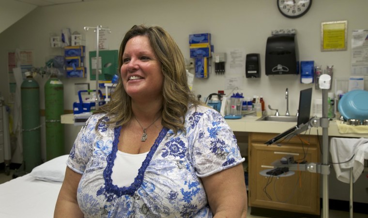 Nancy Rosaaen, the CEO of the McCone County Health Center, sits in the county's one-bed emergency room in Circle, Mont. For years, this town had a single health provider, who was on call 24 hours a day, seven days a week, a requirement to keeping the doors of the ER open. While its services are limited, this room has saved lives--it is the only ER for 50 miles.