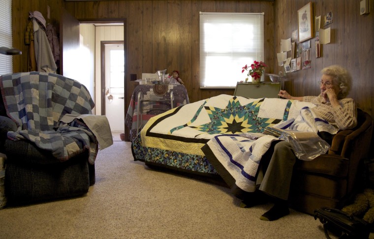 Donna Yarger, 89, in her apartment in Circle, Mont. on May 27, 2014. After her husband Bob passed away in 2011, Yarger no longer felt comfortable living out on their ranch alone, and moved to a one-bedroom apartment in town. She keeps busy making star quilts for friends and family but still feels Bob's absence. Here she sits across from his recliner, which is covered in a denim quilt she sewed him.