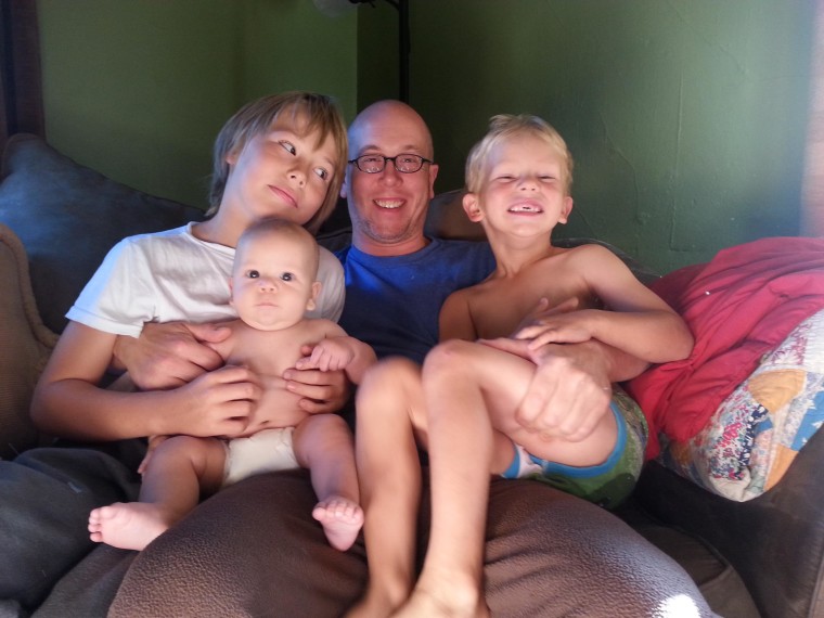 Zach Diamond with his three sons: Jackson, 9; Henry, 4; and Solomon, 6 months. Solomon was born healthy after his parents were told he had a fatal genetic disorder.