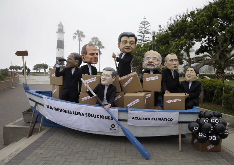 Image: Activists perform as heads of state during the Climate Change Conference COP20 in Lima Peru
