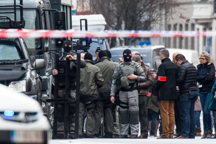 Image: Special forces police prepare their equipment in Ghent, western Belgium