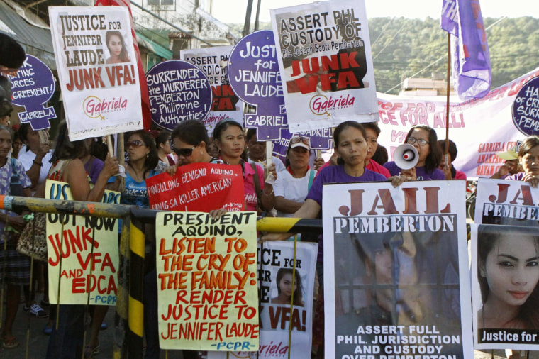 Image: Activists participate in a protest to seek justice for a Filipino transgender Jeffrey Laude, who also goes by the name Jennifer, outside a justice hall at Olongapo city