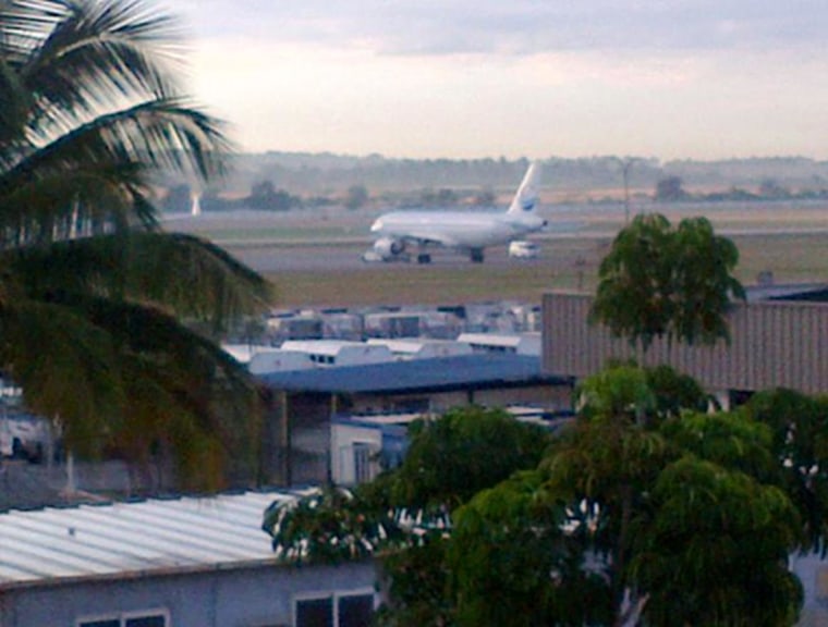 Image: An unidentified plane sits at the end of a runway in Havana, Cuba on Dec. 17, 2014.