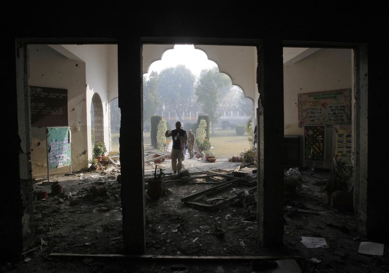 Image:A Pakistan army soldier inspects the Army Public School