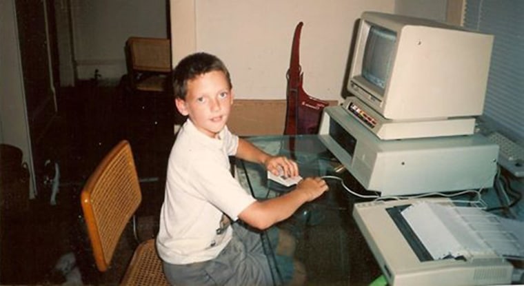 Image: Greg Martin at 8 years old in front of the falimy computer.