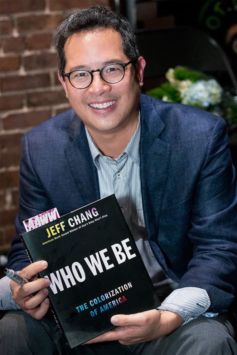 Jeff Chang holds a copy of his new book, "Who We Be: The Colorization of America."