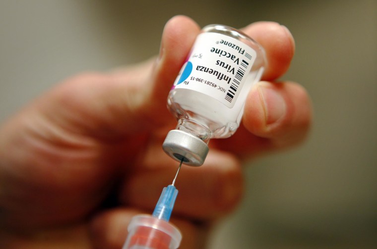 A nurse prepares an injection of the influenza vaccine at Massachusetts General Hospital in Boston, Mass., on Jan. 10, 2013.