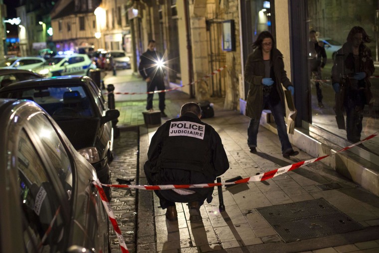 Image: Police examine the scener in Dijon