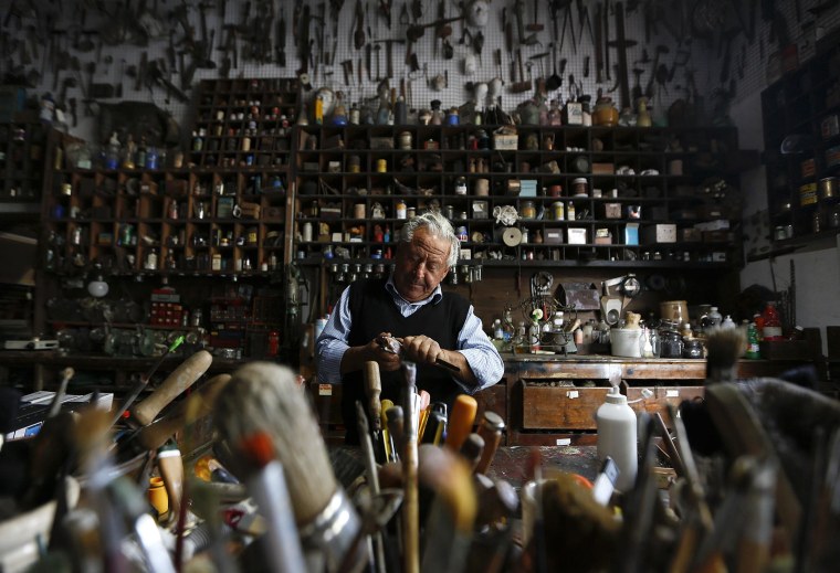 Image: Italian collector Domenico Agostinelli works in his museum in Dragona