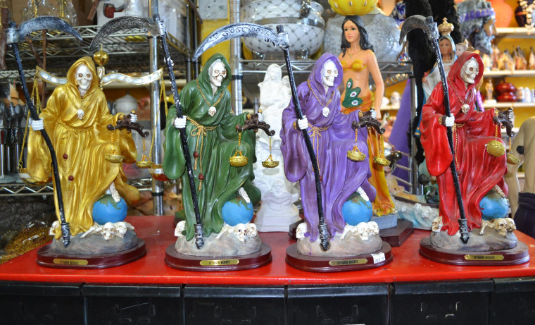 Image: Statues of Santa Muerte for sale at EL Viejo Lazaro Botanica