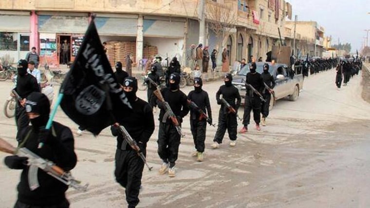 Image: Fighters from ISIS march in Raqqa, Syria, in January.