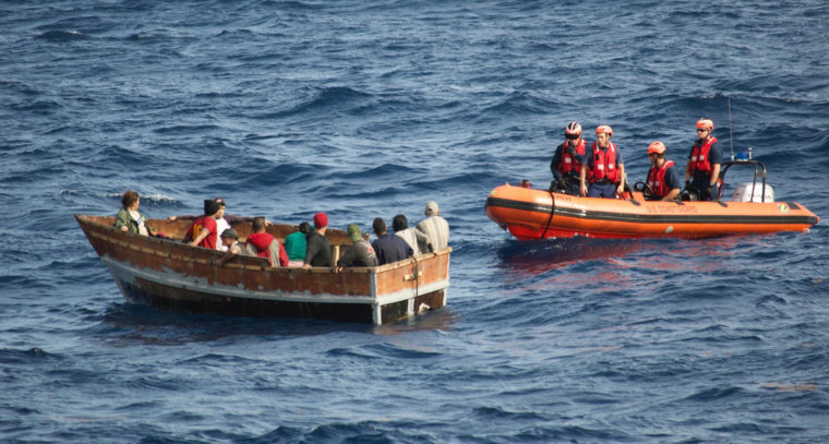 Image: A US Coast guard supplied image of men rescued from a boat off of Florida.