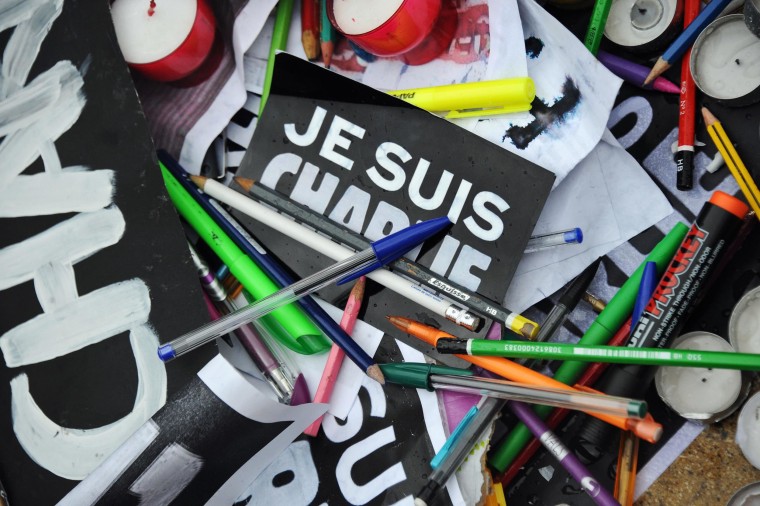 Image: Pens and signs reading 'I am Charlie''