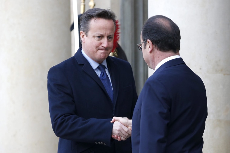 Image:  French President Francois Hollande (R) welcomes British Prime Minister David Cameron (L) at the Elysee Palace before they participate in a march to honor the victims of the terrorist attacks and to show unity, in Paris, France, 11 January 2014