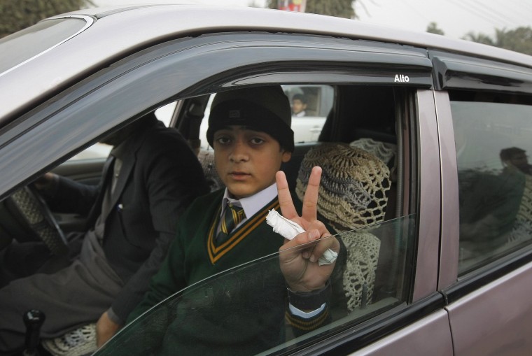 Image: Mohammad Baqair, who survived the Taliban attack on a school that killed his mother