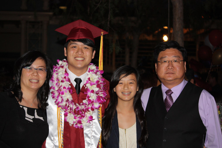 Alton Wang (second from left) celebrates his high school graduation at the Santa Anita racetrack in Arcadia, California with his family June, 2012.