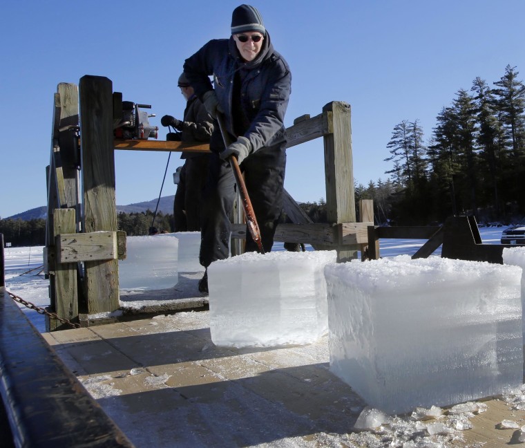 Image: Dave Lacasse loads blocks of ice weighing 120 to 160 pounds during there annual ice harvest