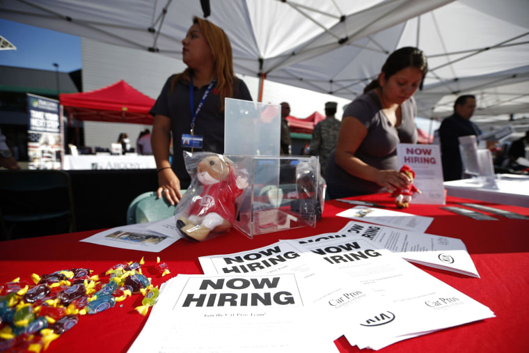 Image: Recruiters wait at a booth at a military veterans' job fair in Carson