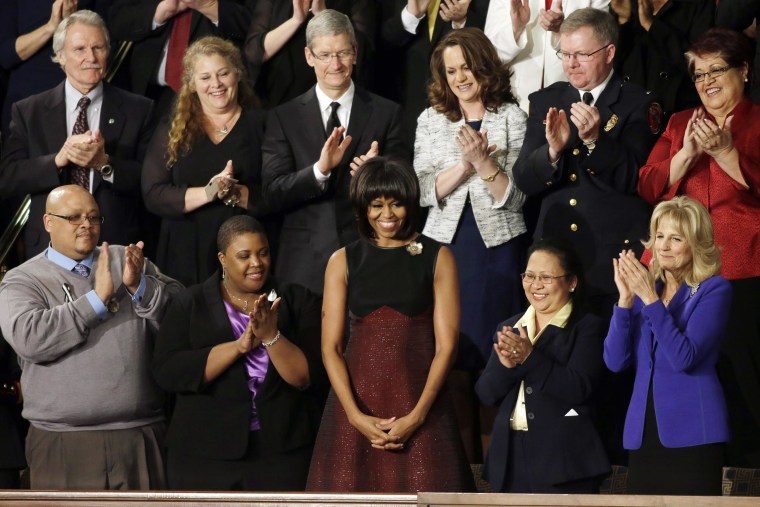 First lady Michelle Obama is applauded before the State of the Union address in 2013.
