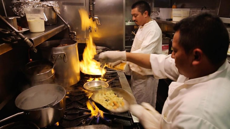 Image: Chefs cook at Zazie, a San Francisco restaurant that provides every member of the staff with full benefits, including a 401(k).