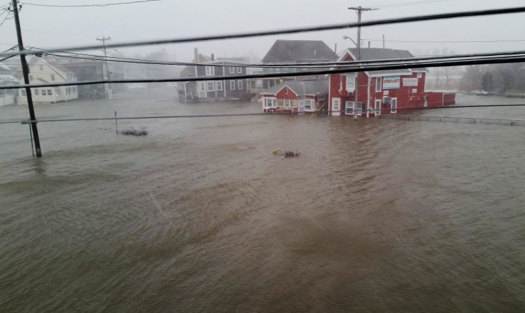 A flooded street in Brant Rock, a neighborhood of the town of Marshfield, Massachusetts, after a winter storm on Jan. 27, 2015.