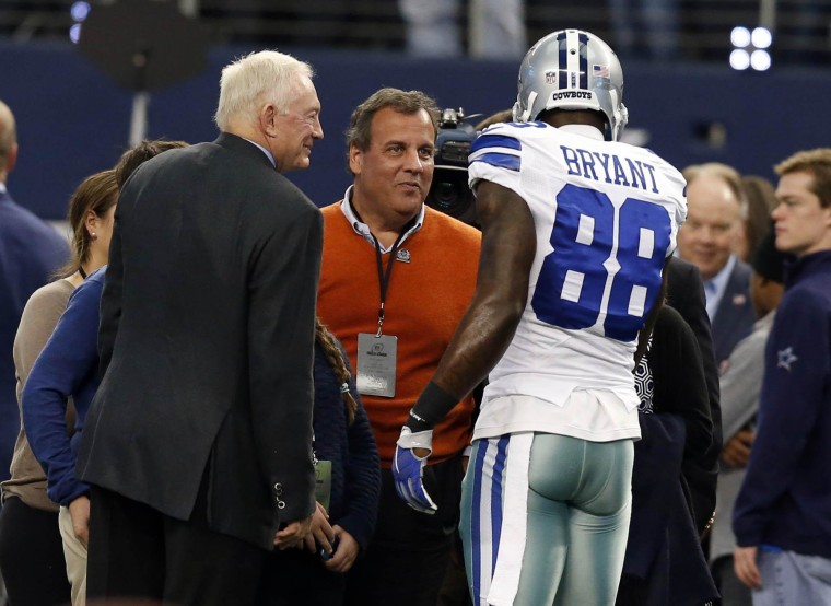 Jan 4, 2015; Arlington, TX, USA; New Jersey governor Chris Christie (center) greets Dallas Cowboys wide receiver Dez Bryant (88) and owner Jerry Jones prior to the game against the Detroit Lions in the NFC Wild Card Playoff Game at AT&T Stadium. Mandatory Credit: Matthew Emmons-USA TODAY Sports