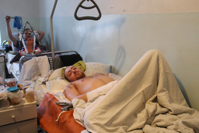 Image: Rebel soldier in hospital