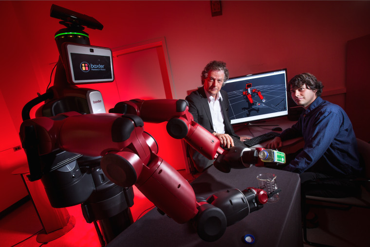Yiannis Aloimonos (center), one of the UM researchers working on the robotics project.