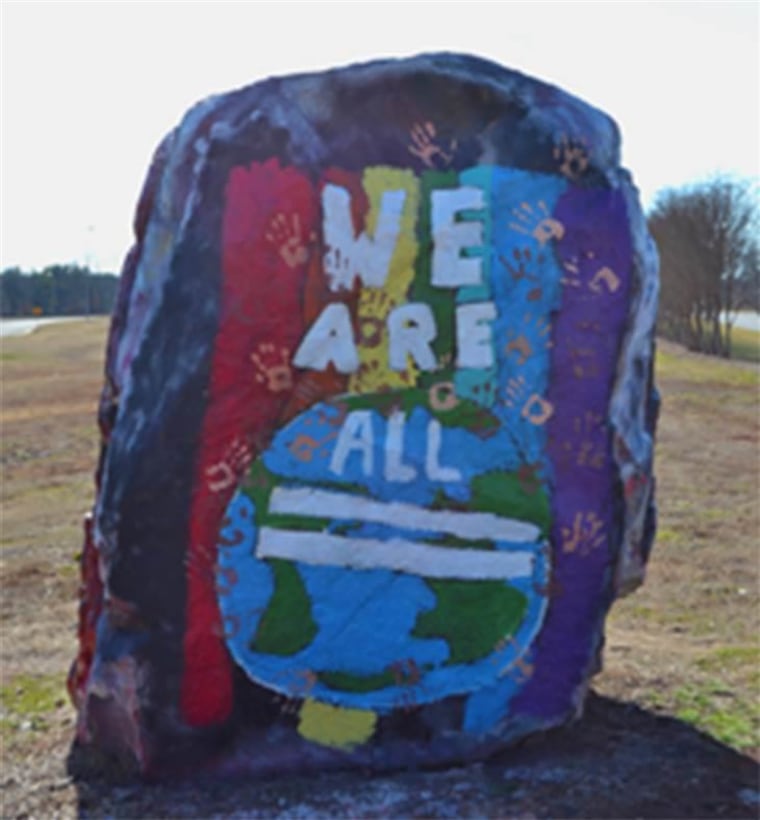 painting remakes defaced rock.